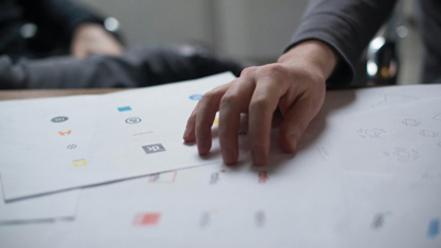 What We Do, a picture of someone explaining layouts for websites